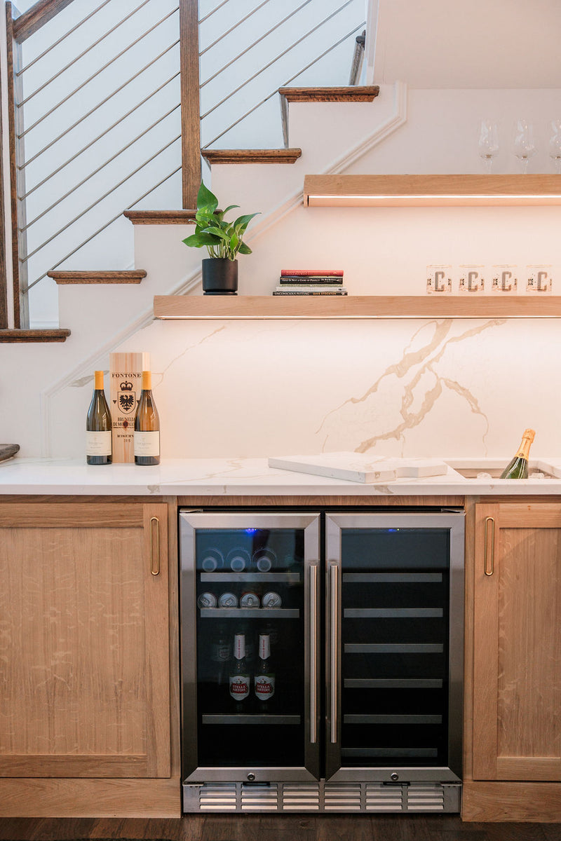 A wet bar with custom white oak floating shelving and marble backsplash ITB Raleigh NC