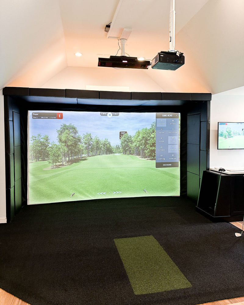 home golf simulator room in North Raleigh, NC with impact screen and projector