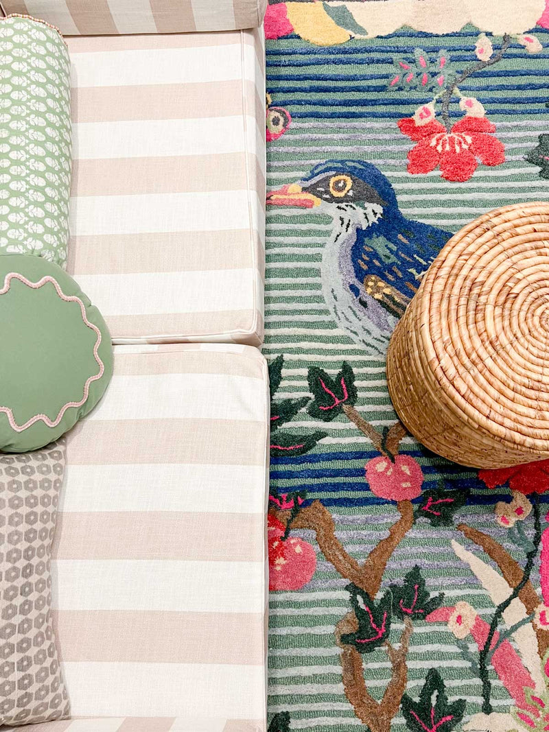 kids playroom design with modular couch and bird rug